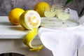 Italian liqueur limoncello in crystal glasses and ripe lemons on a wooden table Royalty Free Stock Photo