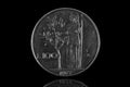 100 italian lira coin from 1977 isolated on black Royalty Free Stock Photo