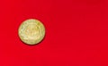 Italian 200 lire coin.Front side of old Used two hundred Italian lire, 1983. Vintage bronze coin isolated on red background with