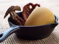 Italian lumaconi pasta in a frying pan.