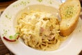 Classic style pasta Ã¢â¬ÅcarbonaraÃ¢â¬Â spaghetti cream sauce with pork cheeks, parmesan cheese and side dish