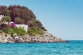 Italian maritime coast of the Island of Elba with rocky ridge and perched house. Sea in Italy in the city of Procchio Royalty Free Stock Photo