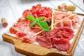 Italian meat antipasti set on wooden surfaces