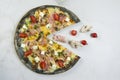 Meat black dough Pizza with ingredients instead one piece of pizza on white marble background Royalty Free Stock Photo