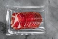 Italian meat cold cuts pack, on gray stone table background, top view flat lay Royalty Free Stock Photo