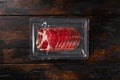 Italian meat cold cuts pack, on old dark  wooden table background, top view flat lay, with copy space for text Royalty Free Stock Photo