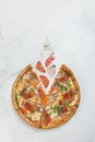 Italian meat Pizza with vegetables on white marble background with ingredients Royalty Free Stock Photo