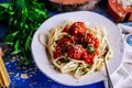 Italian meatballs in tomato sauce with pasta..style rustic Royalty Free Stock Photo