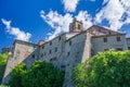 Italian medieval village details, historical stone church and abbey, old city stone buildings architecture. Santa Fiora, Tuscany,