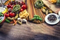 Italian and Mediterranean food ingredients on old wooden background. Royalty Free Stock Photo