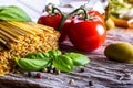 Italian and Mediterranean food ingredients on old wooden background. Royalty Free Stock Photo