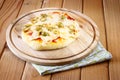 Italian Mini pizza. homemade on wooden plate