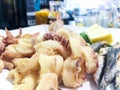 Italian Mixed fried fish, shrimp and squid platter Royalty Free Stock Photo