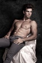 Italian model muscular man sitting. Shirtless portrait Royalty Free Stock Photo