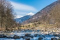 Italian mountain river called Noce River. View of snow covered mountains - Termenago, Val di Sole, Italy, Europe