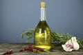 Italian olive oil in bottles with aromatic herbs Royalty Free Stock Photo