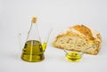 Italian olive oil with bread on white background