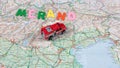 Italian paper travel geographical map with spinning toy car and the inscription holiday Royalty Free Stock Photo