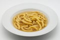 Italian Passatelli. Traditional Italian pasta cooked in broth. Bologna, Italy