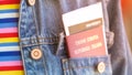 Italian passport and boarding pass in the front pocket of the jeans jacket Royalty Free Stock Photo