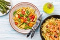 Italian pasta adorned with fresh tomatoes and aromatic basil