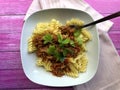 Italian Pasta Asciutta. Fusilli with Sauce Bolognese.