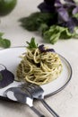 Italian pasta with basil pesto at white plate at light background Royalty Free Stock Photo