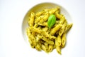 Italian pasta with basil pesto on a white plate Royalty Free Stock Photo