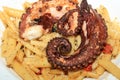Italian Pasta with boiled Octopus on a Plate Royalty Free Stock Photo