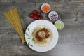 Italian pasta bolognese. Spaghetti and tomato sauce with minced meat and fresh basil on a black background. Royalty Free Stock Photo