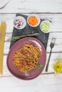 Italian pasta bolognese. Spaghetti and tomato sauce with minced meat and fresh basil on a black background. Royalty Free Stock Photo