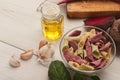 Italian pasta in bowls and laurel leaf on white wood Royalty Free Stock Photo