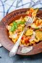 Italian pasta cavatappi with zucchini and tomatoes