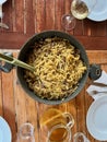 Italian pasta cooking spaghetti with mushrooms. White vino