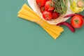 Italian Pasta Dish Ingredients. Fresh Ripe Red Tomatoes Rosemary Thyme in Wicker Basket Olive Oil in Bottle Spaghetti Hot Peppers Royalty Free Stock Photo