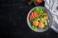 Italian pasta. Farfalle with meatballs and salad on dark background. Royalty Free Stock Photo