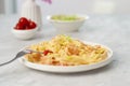 Italian pasta fettuccine with shrimps in white bowl on gray table. Close up beautiful picture homemade national cuisine