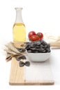 Italian pasta, macaroni quills with cherry tomatoes and olive oil in a glass bottle Royalty Free Stock Photo