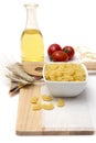 Italian pasta, macaroni quills with cherry tomatoes and olive oil in a glass bottle Royalty Free Stock Photo