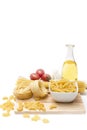 Italian pasta, macaroni quills with cherry tomatoes and olive oil in a glass bottle Royalty Free Stock Photo