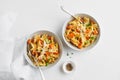 Italian pasta Mafalda Corta trafilata al bronzo with sauteed sweet potato, fennel, parmesan grated cheese on white background.