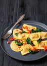 italian pasta mezzelune on a plate, top view