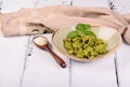 Italian pasta named Orecchiette with pesto of Genoa, sauce and parmesan cheese