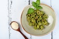 Italian pasta named Orecchiette with pesto of Genoa, sauce and parmesan cheese