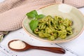 Italian pasta named Orecchiette with pesto of Genoa, sauce and parmesan cheese