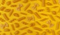 Italian pasta pattern, different pasta types on yellow background, flat lay