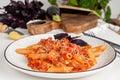 Italian pasta penne with eggplant and tomato sause. Vegan food concept Royalty Free Stock Photo