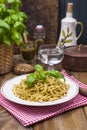 Italian pasta with pesto sauce and fresh basil. A delicious homemade dinner. Photo in a rustic style. Copy space Royalty Free Stock Photo