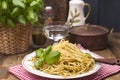 Italian pasta with pesto sauce and fresh basil. A delicious homemade dinner. Photo in a rustic style. Copy space Royalty Free Stock Photo