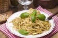Italian pasta with pesto sauce and fresh basil. A delicious homemade dinner. Photo in a rustic style. Copy space Royalty Free Stock Photo